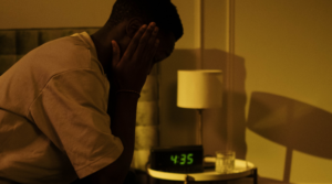 Person with face in their hands