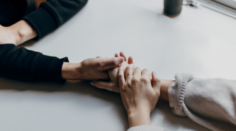 Couple holding hands